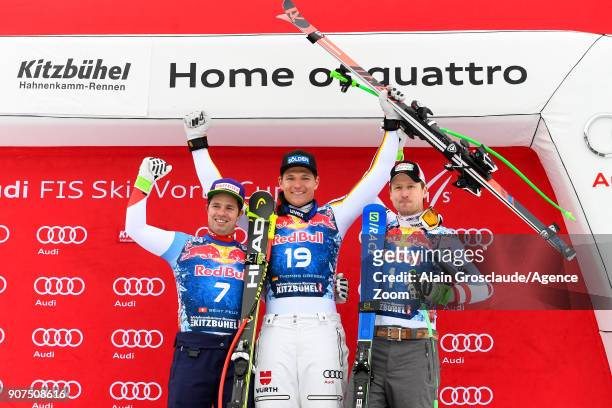 Beat Feuz of Switzerland takes 2nd place, Thomas Dressen of Germany takes 1st place, Hannes Reichelt of Austria takes 3rd place during the Audi FIS...