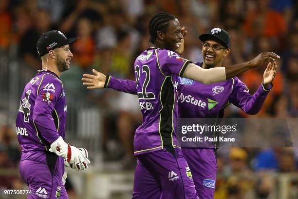 Jofra Archer of the Hurricanes celebrates with Clive Rose following a direct hit to run out Adam Voges of the Scorchers during the Big Bash League...