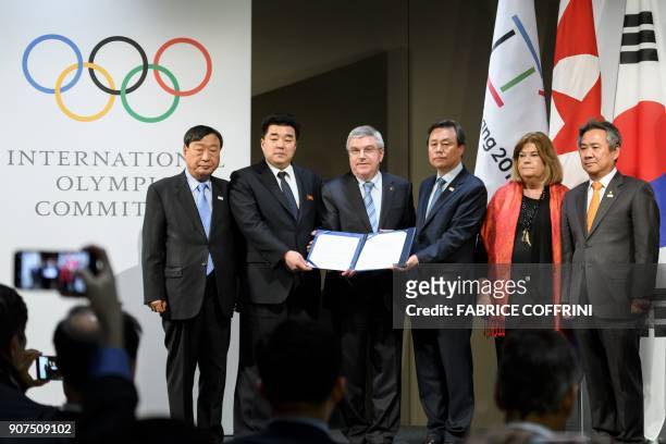 PyeongChang 2018 Olympics President Lee Hee-beom, North Korea's Sports Minister and Olympic Committee president Kim Il Guk, International Olympic...