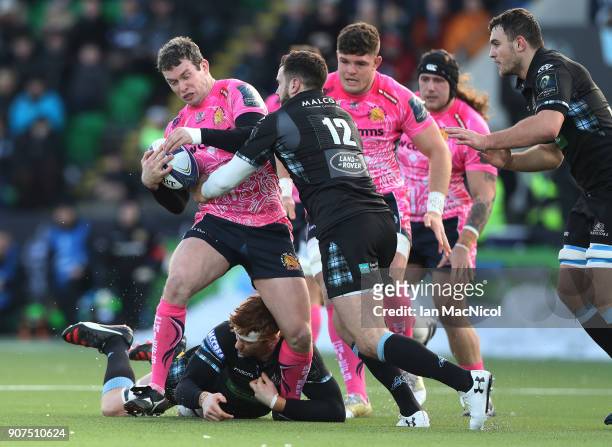 Ian Whitten of Exeter Chiefs is tackled by Alex Dunbar of Glasgow Warriorsl during the European Rugby Champions Cup match between Glasgow Warriors...