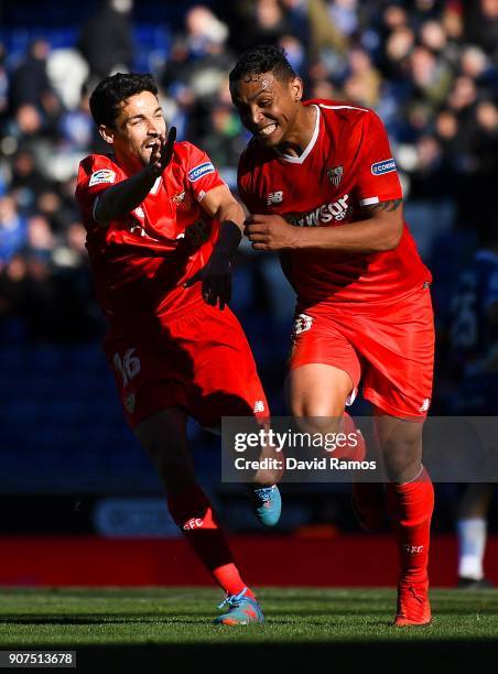 Luis Muriel of Sevilla FC celebrates with his team mate Jesus Navas after scoring his team's third goal during the La Liga match between Espanyol and...