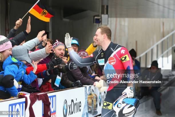 Francesco Friedrich of Germany celebrates victory after winning with his team mate Thorsten Margis at Deutsche Post Eisarena Koenigssee the BMW IBSF...