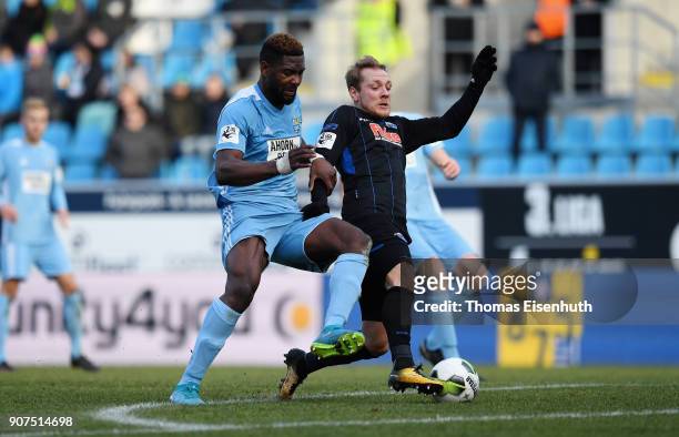 Emmanuel Mbende of Chemnitz is challenged by Ben Zolinski of Paderborn during the 3. Liga match between Chemnitzer FC and SC Paderborn 07 at...