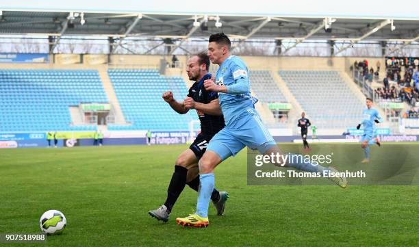 Daniel Frahn of Chemnitz is challenged by Felix Herzenbruch of Paderborn during the 3. Liga match between Chemnitzer FC and SC Paderborn 07 at...