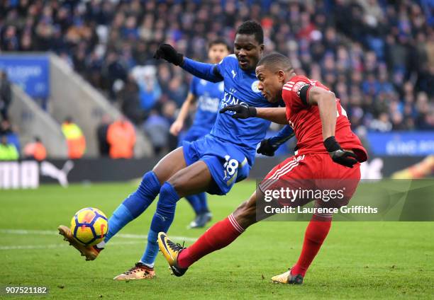 Marvin Zeegelaar of Watford shoots while under pressure from Daniel Amartey of Leicester City during the Premier League match between Leicester City...