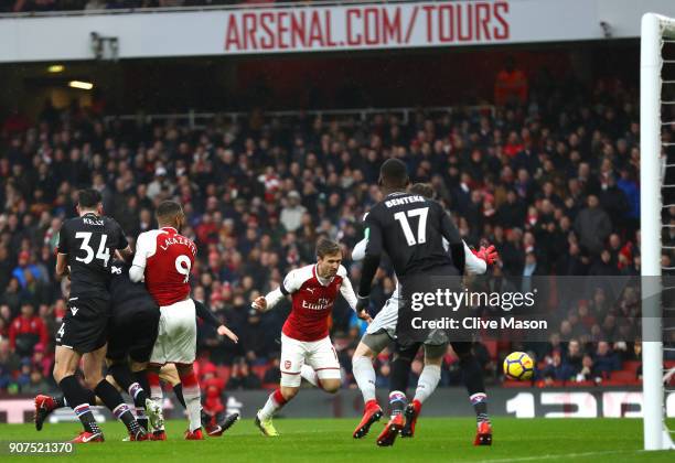 Nacho Monreal of Arsenal scores his sides first goal during the Premier League match between Arsenal and Crystal Palace at Emirates Stadium on...