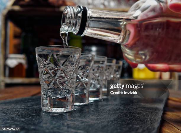 wodka shots - shot glass stock-fotos und bilder