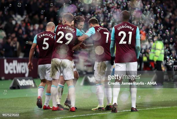 Reece Burke of West Ham United celebrates with his team mates after scoring a goal to make it 1-0 during the Emirates FA Cup Third Round Repaly match...