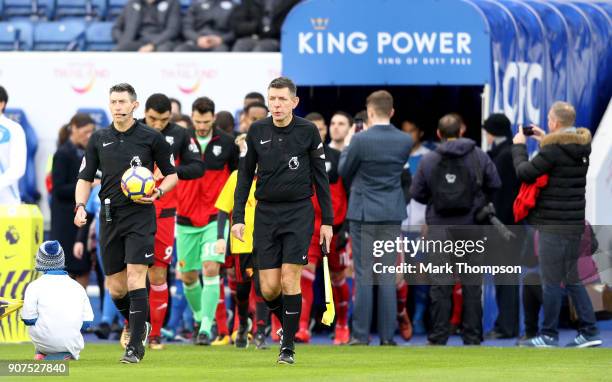 Match Referee, Lee Probert leads out teams to the pitch ahead of the Premier League match between Leicester City and Watford at The King Power...