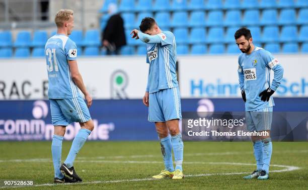 Tom Scheffel , Daniel Frahn and Okan Aydin of Chemnitz react after the 3. Liga match between Chemnitzer FC and SC Paderborn 07 at community4you ARENA...
