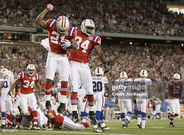 Running back Fred Taylor of the New England Patriots celebrates scoring a touchdown with teammate Benjamin Watson in the second quarter of the game...