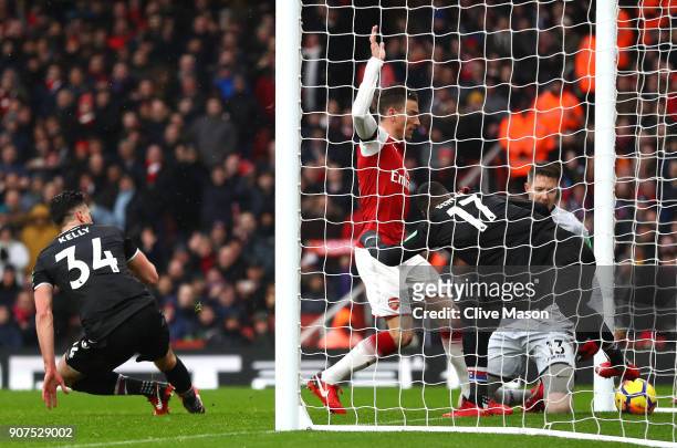 Laurent Koscielny of Arsenal scores his sides third goal during the Premier League match between Arsenal and Crystal Palace at Emirates Stadium on...