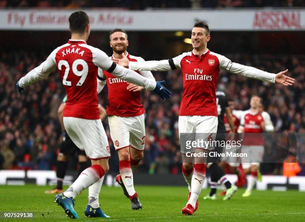 Laurent Koscielny of Arsenal celebrates after scoring his sides third goal with Granit Xhaka of Arsenal during the Premier League match between...