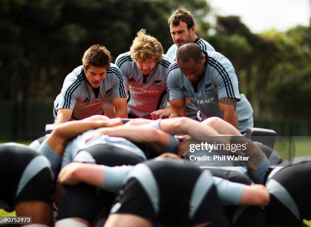 Richie McCaw, Adam Thomson, Andrew Hore and Neemia Tialata lend weight to the scrum machine during the New Zealand All Blacks training session at...