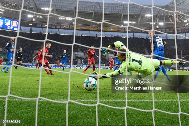 Leon Bailey of Bayer Leverkusen scores a goal past goalkeeper Oliver Baumann of Hoffenheim to make it 0:1 during the Bundesliga match between TSG...