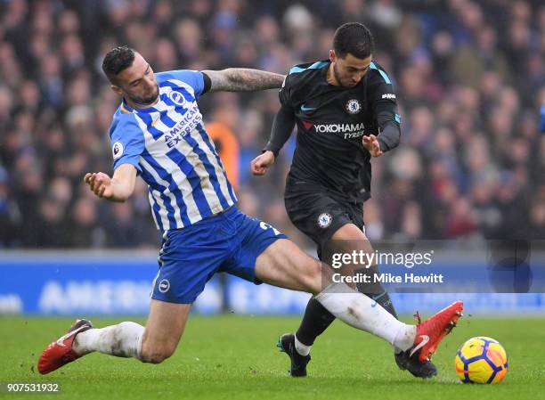 Eden Hazard of Chelsea is tackled by Shane Duffy of Brighton during the Premier League match between Brighton and Hove Albion and Chelsea at Amex...