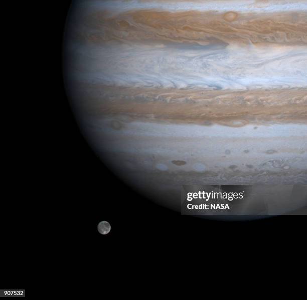 The solar system's largest moon, Ganymede, is captured here alongside the planet Jupiter in this picture taken by NASA's Cassini spacecraft, December...