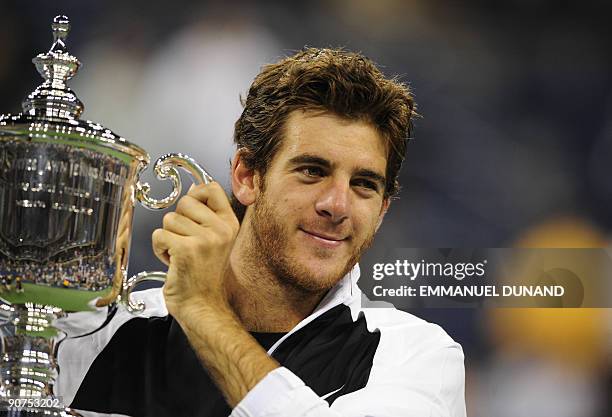 Tennis player Juan Martin Del Potro of Argentina holds his trophy after beating Roger Federer of Switzerland in the final of the 2009 US Open at the...