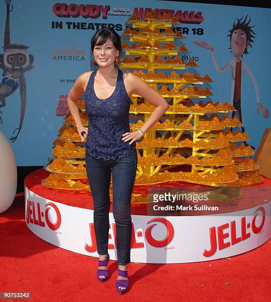 Actress Lindsay Price poses in front of a Jell-O Castle at Mann Village Theatre on September 12, 2009 in Westwood, Los Angeles, California.