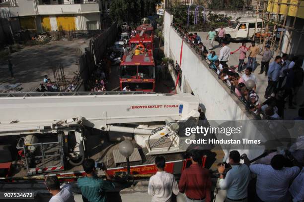 Fire Brigade outside building after the fire broke out in a 26-storey residential building, Giriraj Heights, Panchpakhadi, on January 19, 2018 in...