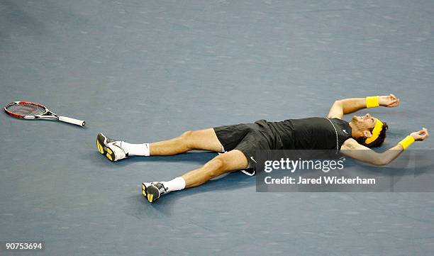 Juan Martin Del Potro of Argentina celebrates championship point after defeating Roger Federer of Switzerland in the Men's Singles final on day...