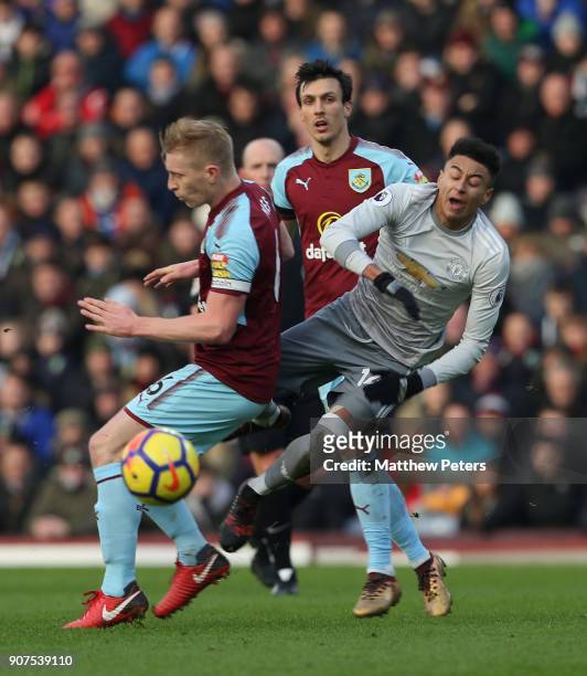Jesse Lingard of Manchester United in action with Ben Mee of Burnley during the Premier League match between Burnley and Manchester United at Turf...