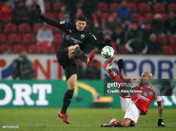 Mario Gomez of Stuttgart is challenged by Nigel de Jong of Mainz during the Bundesliga match between 1. FSV Mainz 05 and VfB Stuttgart at Opel Arena...