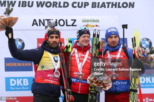 Johannes Thingnes Boe of Norway takes 1st place, Martin Fourcade of France takes 2nd place, Anton Shipulin of Russia takes 3rd place during the IBU...