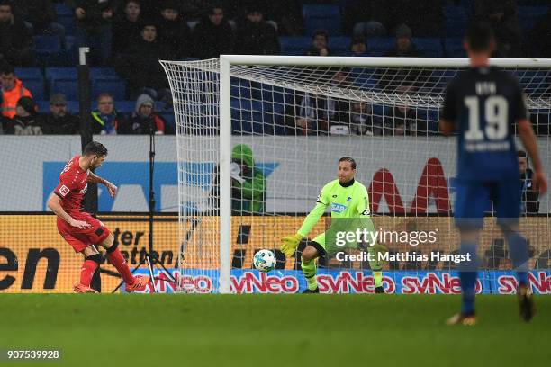 Lucas Alario of Leverkusen scores a goal past goalkeeper Oliver Baumann of Hoffenheim to make it 0:3 during the Bundesliga match between TSG 1899...