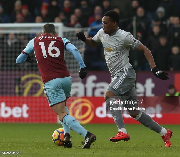 Anthony Martial of Manchester United in action with Steven Defour of Burnley during the Premier League match between Burnley and Manchester United at...