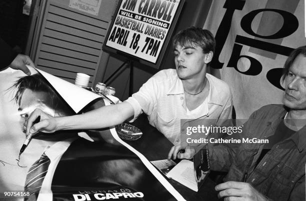 American actor Leonardo DiCaprio and American poet, author and musician Jim Carroll sign books and posters of "The Basketball Diaries" in 1995 in New...