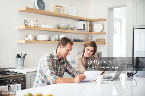 we can process all these payments online with ease - home finances couple bright stock pictures, royalty-free photos & images