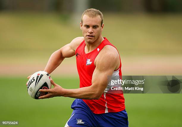 Daniel Holdsworth runs with the ball during a Bulldogs NRL training session at Sydney Olympic Park on September 15, 2009 in Sydney, Australia.