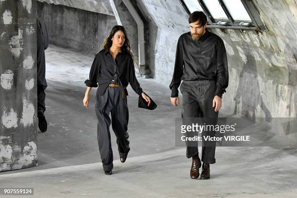 Fashion designers Christophe Lemaire and Sarah-Linh Tran walk the runway during the Lemaire Menswear Fall/Winter 2018-2019 show as part of Paris...