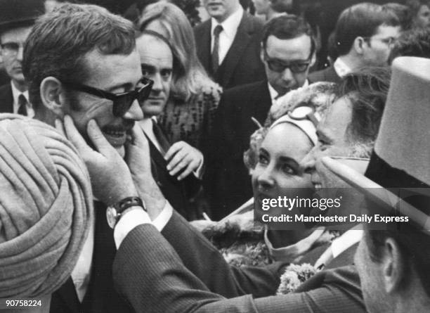 "That's a lovely tash, boy", says Richard Burton to Peter O'Toole. Burton can't believe shadow on the upper lip of old pal O'Toole.'