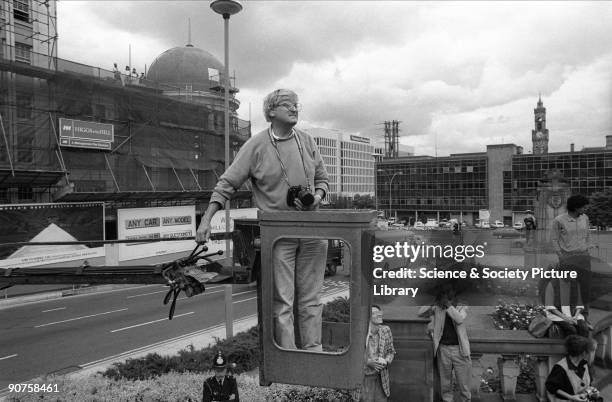 British artist David Hockney taking photographs to create a 'joiner' photographic collage of the National Museum of Photography, Film & Television....