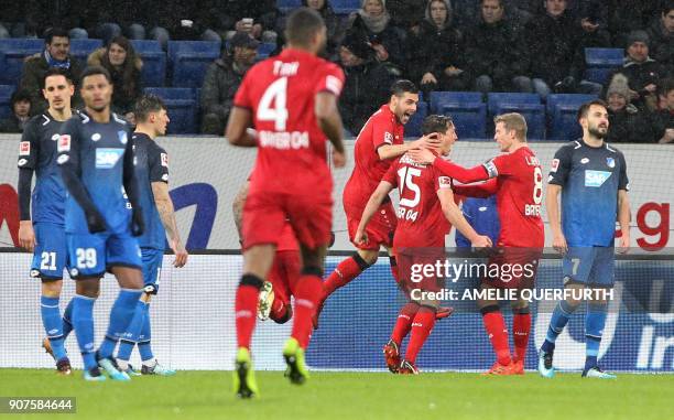 Leverkusen's Austrian midflielder Julian Baumgartlinger is congratulated by teammates after scoring the 0-2 during the German first division...