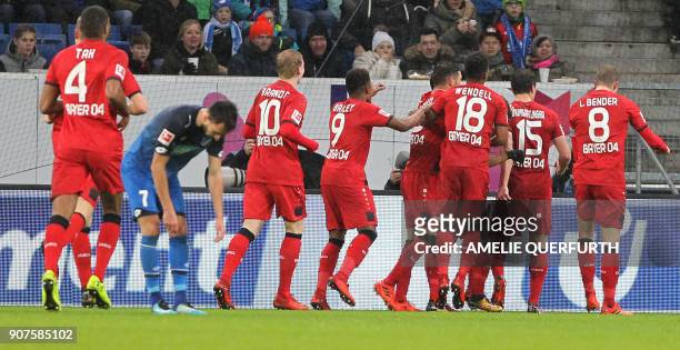 Leverkusen's Austrian midflielder Julian Baumgartlinger is congratulated by teammates after scoring the 0-2 during the German first division...