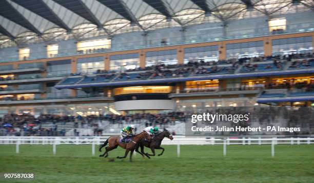 Vinndication and Sean Bowen get the better of Champ ridden by Aidan Coleman to win The Rosling King British EBF Novices' Hurdle Race run during...