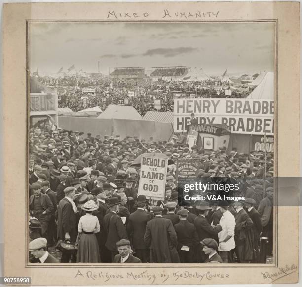 Gelatin silver print. Photograph by Horace W Nicholls of a religious meeting at the Derby horse-racing course in Epsom, Surrey. Banners in the...