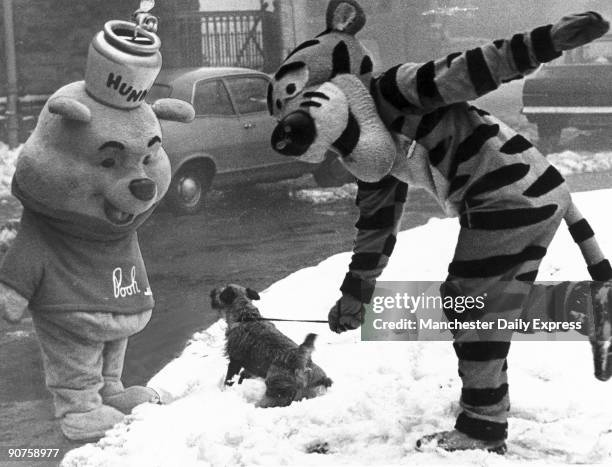 Characters from the books by A A Milne took Tim the terrier for an afternoon stroll during a break from the International Toy Fair in Harrogate,...