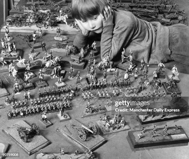 Year-old David Hinchcliffe with £1000 worth of model soldiers at the workshop of Frank X Hinchcliffe , who makes the models in a converted public...