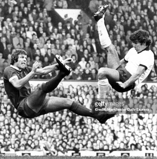Aerial combat between Toshack of Liverpool and Newton of Derby County.