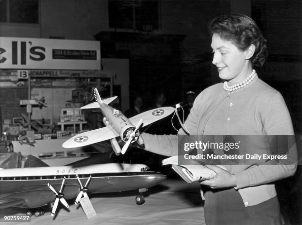 Mrs Una McClean of Brooklands, Cheshire, looking at a model made by Mrs Eileen Whiston of Stratford.�