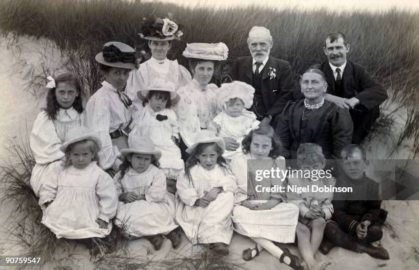 Family group in the sand dunes, late 19th-early 20th century.