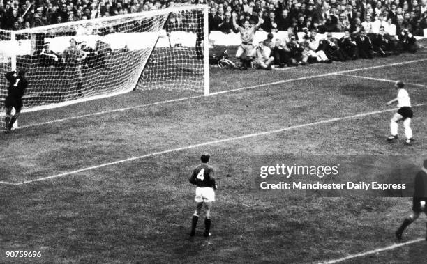 Lev Yashin of the Soviet Union clutches the post as Franz Beckenbauer?s shot rebounds across the net. West Germany beat the Soviet Union 2-1.