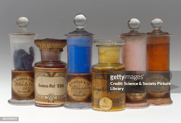 Six jars containing synthetic colorants. Blue Lilac 20 manufactured by G. Siegle & Co. Of Stuttgart; Guinea-Rot SDG by Actien Gesellschaft für Anilin...