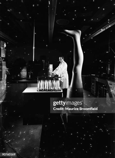 Nylon stocking test. Pontypool; Wales; 1957. Photograph by Maurice Broomfield. A researcher at British Nylon Spinners tests the strength of nylon...