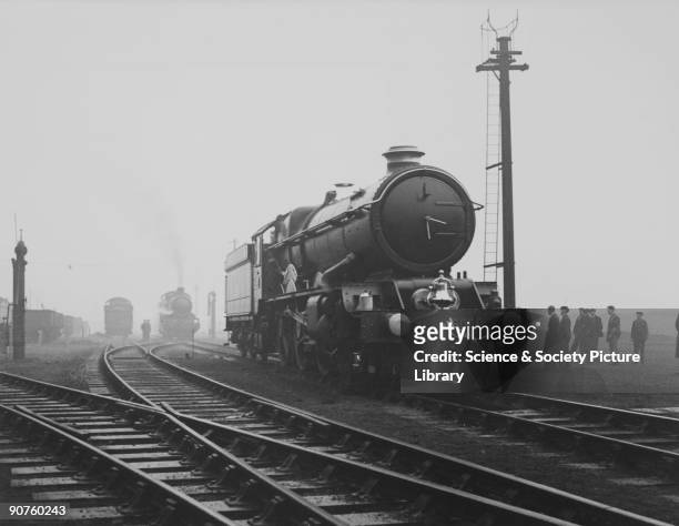Old Oak Common on the morning of the 29.11.34 with King class loco no 6000 'King George V' being prepared for a special train for the Duke of Kent...