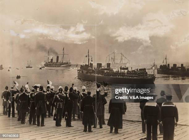 Gelatin silver print. Photograph by Horace W Nicholls of steam ships with a farewell party of officers and sailors.